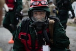 Senior Airman Cassandra Wachowiak, an aerospace medic with the 157th Medical Group, interacts with a patient during a radiological response training exercise Aug. 15, 2023, at Joint Base Cape Cod, Massachusetts. The 157th MDG was tested on its response to a radiological disaster and received a perfect score.