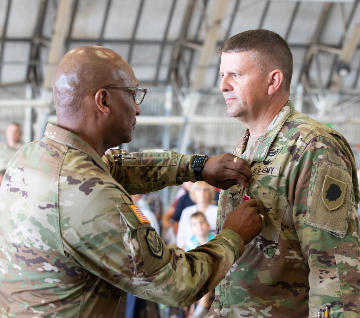 Maj. Gen. Rodney Boyd, Assistant Adjutant General - Army and Commander of the Illinois Army National Guard, presents Col. Jason Osberg with the Legion of Merit during the change of command ceremony on Aug. 27, 2023 at the Army Aviation Support Facility in Peoria, Illinois.