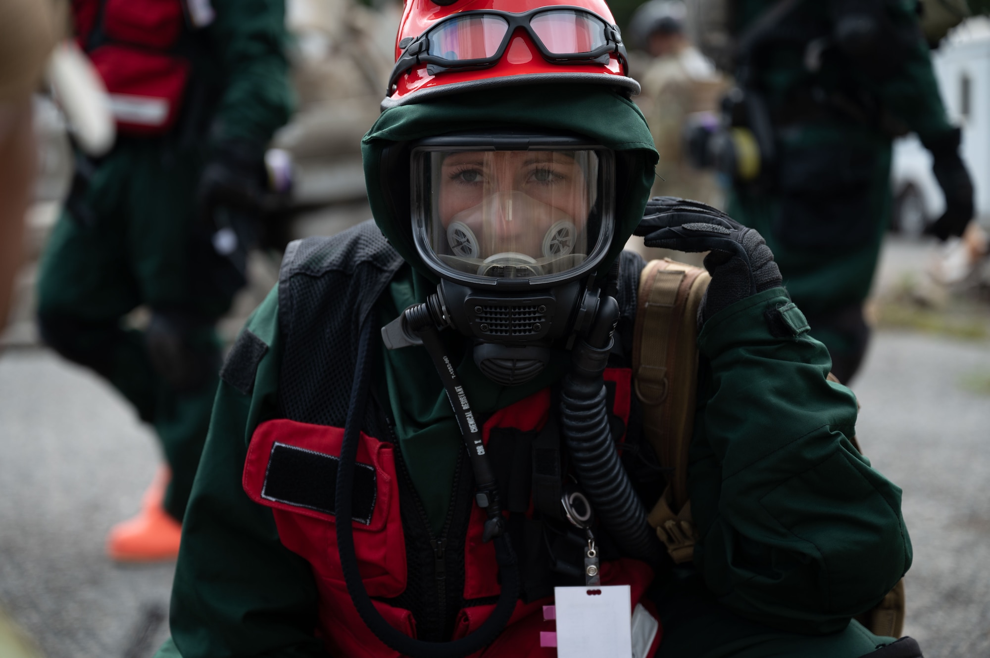 Senior Airman Cassandra Wachowiak, an aerospace medic with the 157th Medical Group, interacts with a patient during a radiological response training exercise Aug. 15, 2023, at Joint Base Cape Cod, Massachusetts. The 157th MDG was tested on its response to a radiological disaster and received a perfect score.