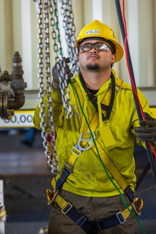 In their own words: Devin Atalig 
Rigger, Code 740, Riggers 
“If I was to describe my job in one word, it would be teamwork. We rely on every person in the crew when a job is at hand. I learned teamwork very young playing sports.” (U.S. Navy photo by Wendy Hallmark)
