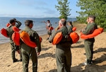 Airmen from the 109th Airlift Wing participate in water survival and parachute refresher training on Great Sacandaga Lake in Mayfield, New York, Aug. 5-6, 2023. Airmen received flotation device and life raft familiarization training.