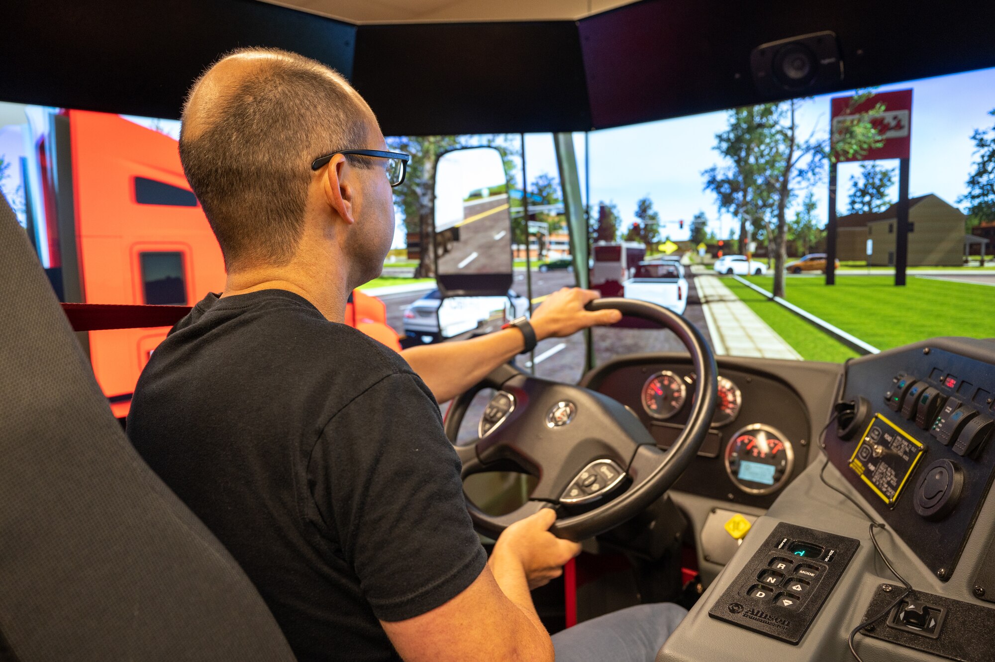 James Murray drives a simulated firetruck