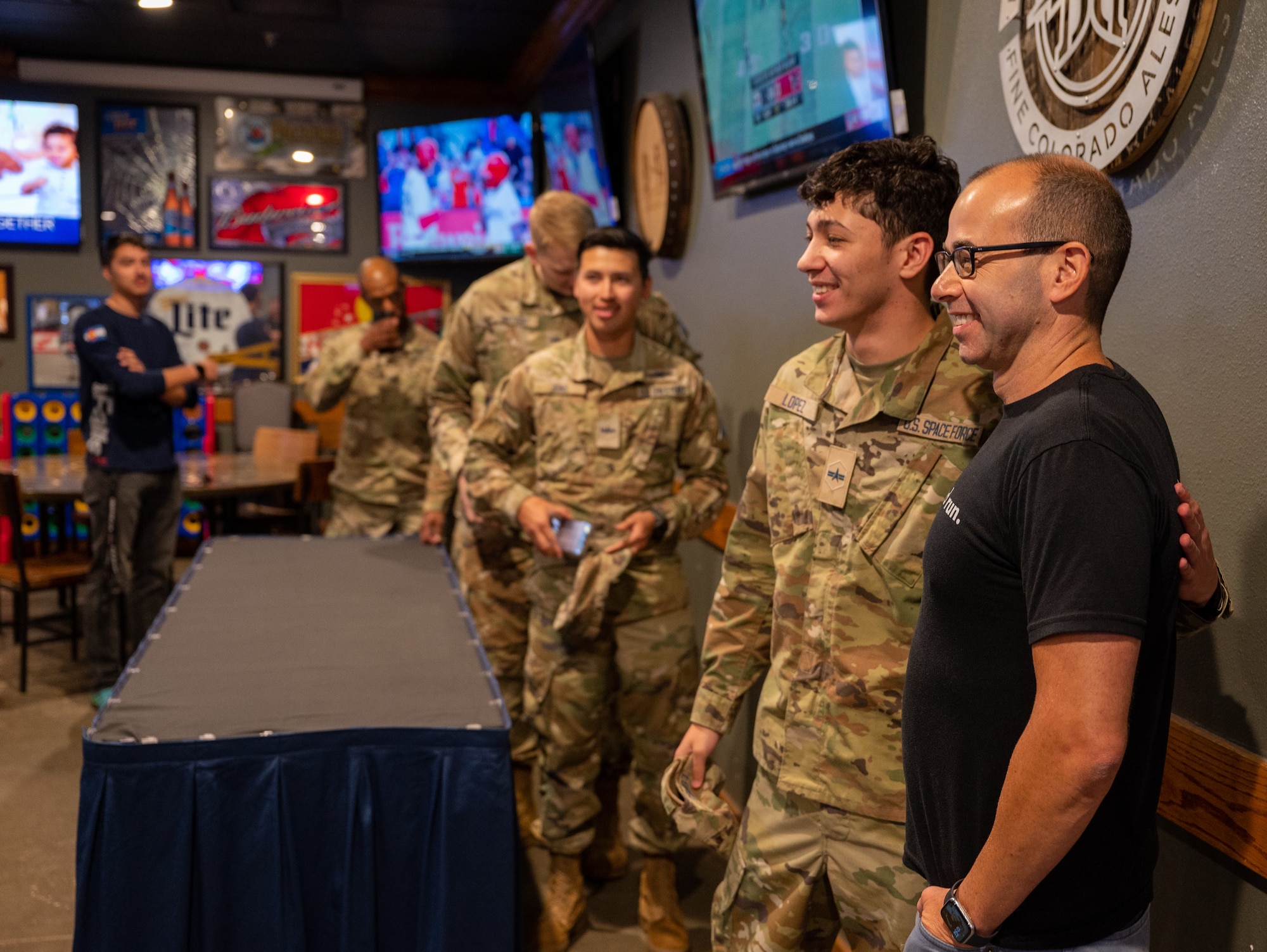 James Murray poses for a photo with U.S. service members