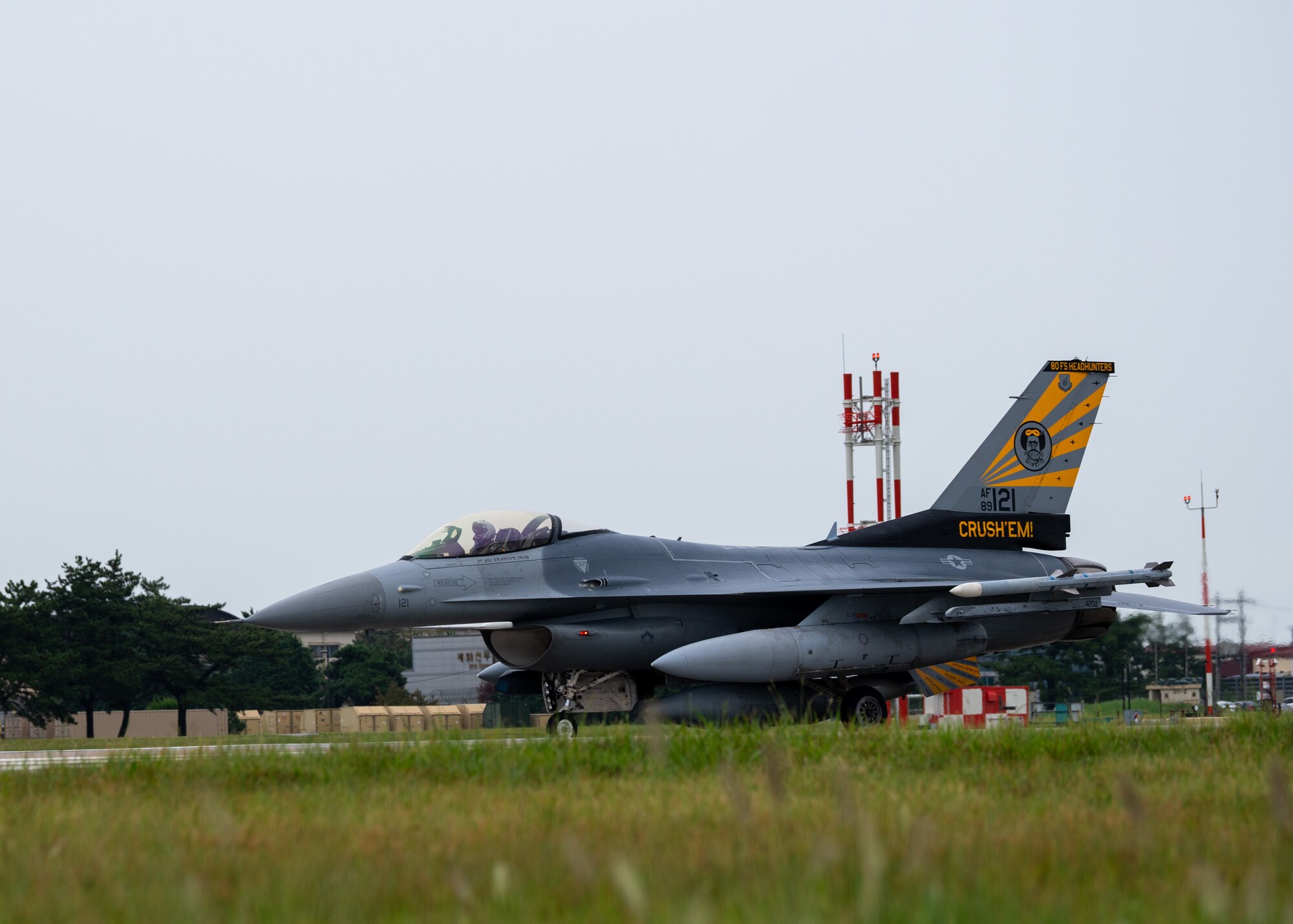 A U.S. Air Force F-16 Fighting Falcon assigned to the 80th Fighter Squadron taxis after landing.