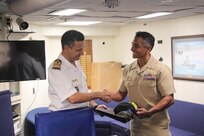 Cmdr. Corry Lougee, commanding officer of the Arleigh Burke-class guided-missile destroyer USS Paul Ignatius (DDG 117), exchanges gifts with the commanding officer the Royal Moroccan Sigma-class corvette frigate RMNS Sultan Moulay Ismail (614), onboard in preparation for exercise Atlas Handshake 2023, Aug. 25, 2023. Paul Ignatius is on a scheduled deployment in the U.S. Naval Forces Europe area of operations, employed by the U.S. Sixth Fleet to defend U.S., allied and partner interests. (U.S. Navy photo by Mass Communication Specialist 1st Class Zac Shea)