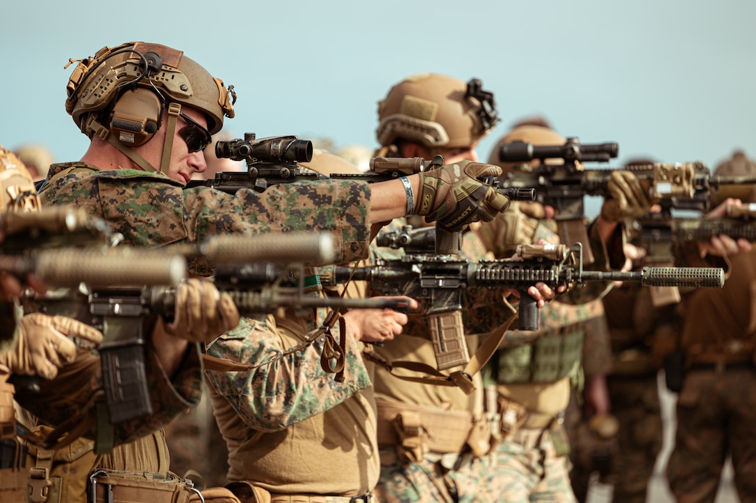 A U.S. Marine with Battalion Landing Team 2/1, 31st Marine Expeditionary Unit, fires his M27 weapon system during a deck shoot aboard the amphibious transport dock ship USS Green Bay, in the Pacific Ocean, Aug. 23, 2023. The Marines conducted the live-fire training to improve their ability to engage targets at close distances. The 31st MEU is operating aboard ships of the America Amphibious Ready Group in the 7th  Fleet area of operations to enhance interoperability with allies and partners and serve as a ready response force to defend peace and stability in the Indo-Pacific region.