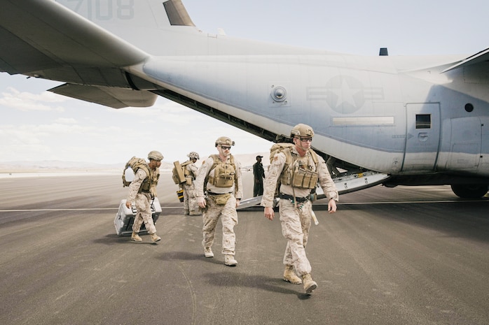 U.S. Marines assigned to the 15th Marine Expeditionary Unit arrive at Reno-Stead Airport, Nevada, on a KC-130J Super Hercules attached to Marine Aerial Refueler Transport 352, Marine Aircraft Group 11, 3rd Marine Aircraft Wing, to conduct a simulated military assisted departure during Realistic Urban Training exercise, Aug. 24, 2023. During the scenario, the 15th MEU conducted a mission to coordinate with a U.S. Consulate until the situation necessitated an evacuation of consulate staff and American citizens from the area. RUT is a land-based predeployment exercise which enhances the integration and collective capability of the Marine Air-Ground Task Force while providing the 15th MEU an opportunity to train and execute operations in an urban environment.