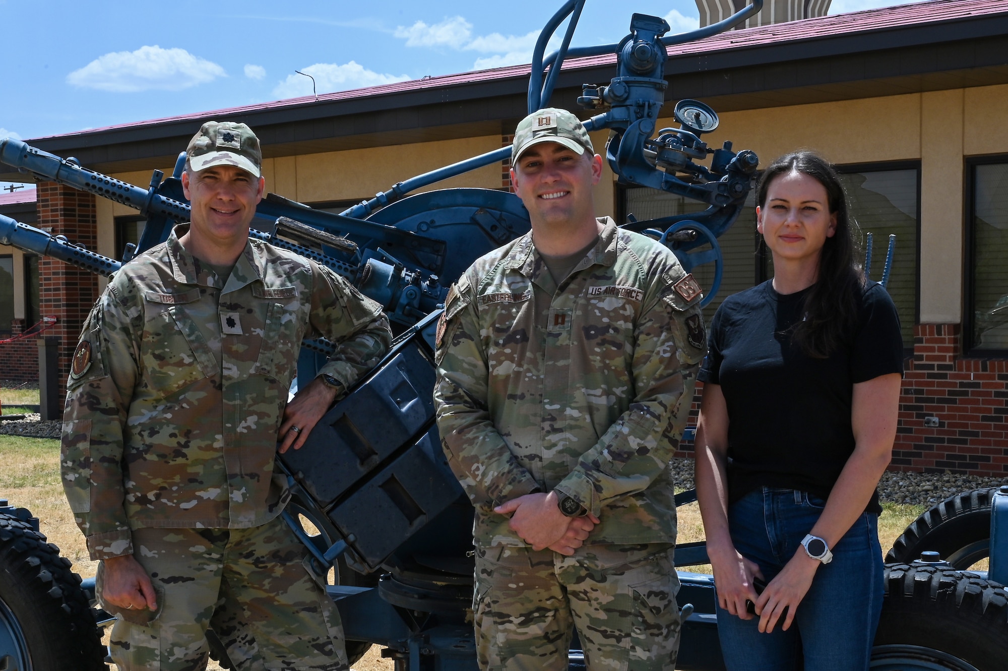 Members of the Dyess Operational Support Team pose in front of the 317th Airlift Wing combined building at Dyess Air Force Base, Texas, Aug. 24, 2023. OST typically consists of four members: a physical therapist, strength and conditioning coach, team specialist and a mental health professional. (U.S. Air Force photo by Senior Airman Sophia Robello)
