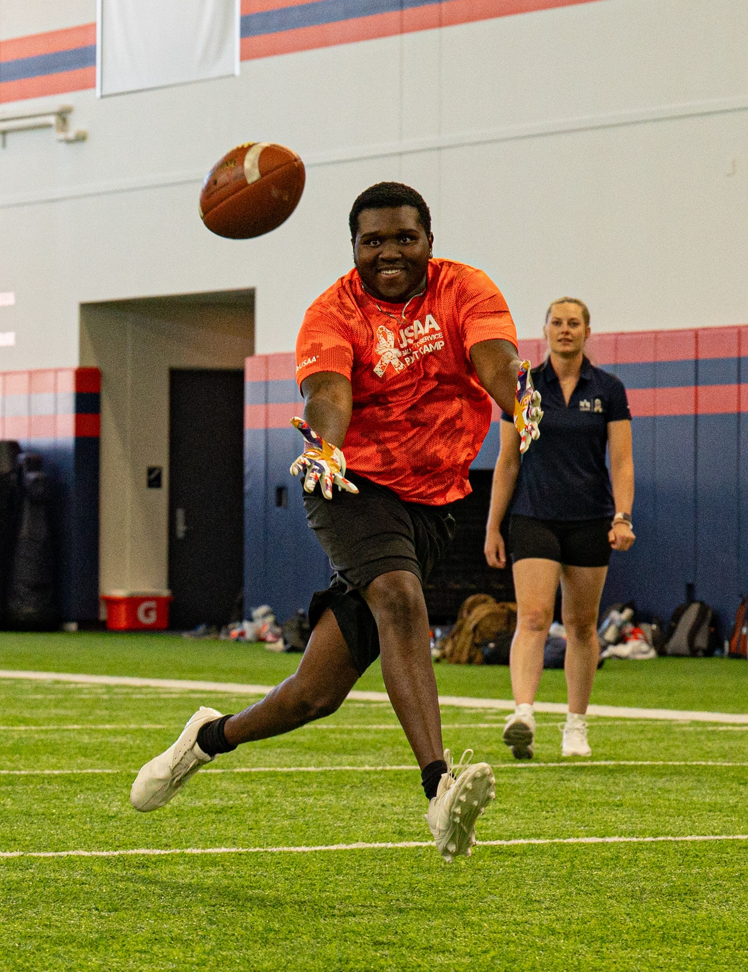 man catching football