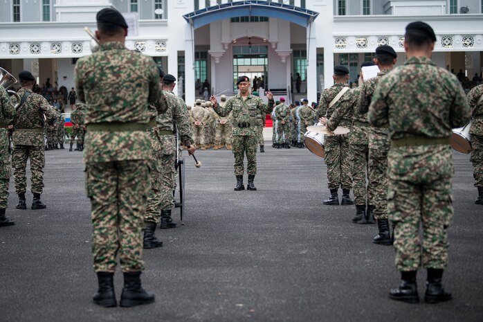 Band members with the Malaysian Armed Forces participate in the closing ceremony of Exercise Keris Aman 23, a Multinational Peacekeeping Exercise, at the Malaysian Peacekeeping Centre on Aug. 26, 2023. Keris Aman 23 is a multinational United Nations Peacekeeping (UN PKO) exercise conducted in Malaysia and co-sponsored by U.S. Indo-Pacific Command and the Malaysian Armed Forces. The exercise is designed to strengthen military-to-military relationships and enhance the core PKO competencies of all participants in accordance with UN doctrine. (U.S. Marine Corps photo by Lance Cpl John Hall)