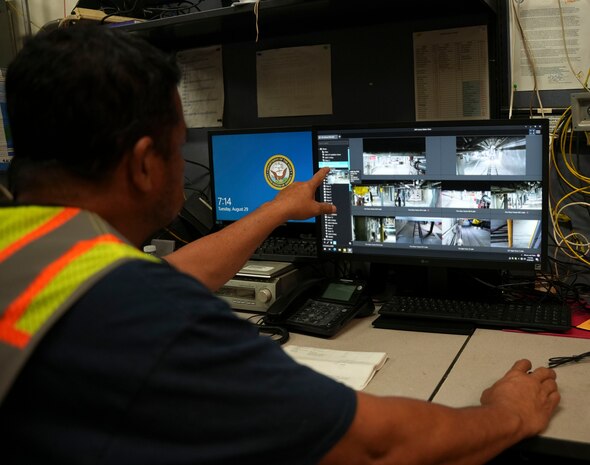 A civilian employee assigned to Joint Task Force-Red Hill (JTF-RH) monitors video feeds from the newly installed cameras at the Red Hill Bulk Fuel Storage Facility (RHBFSF), Halawa, Hawaii, Aug. 29, 2023. The cameras represent one layer of JTF-RH’s multi-layered approach implemented to quickly respond to a threat to the environment or human safety which are monitored 24-hours a day during fuel line repacking and defueling of the storage tanks. Repacking is necessary to remove all air from the pipelines and ensure a stable flow if fuel when gravity defueling the main underground storage tanks. (DoD photo by U.S. Marine Corps Cpl. Gabrielle Zagorski)