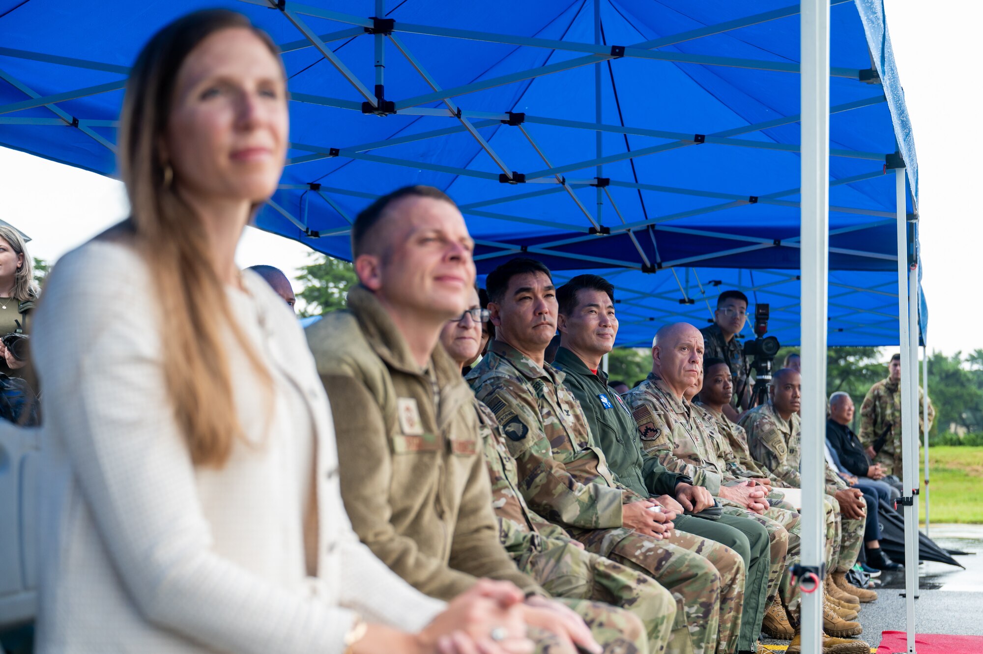 Members of the U.S. Air Force 8th Fighter Wing, Republic of Korea Air Force 38th Fighter Group and the Army Corp of Engineers Far East District, gather and listen to the presiding officer.