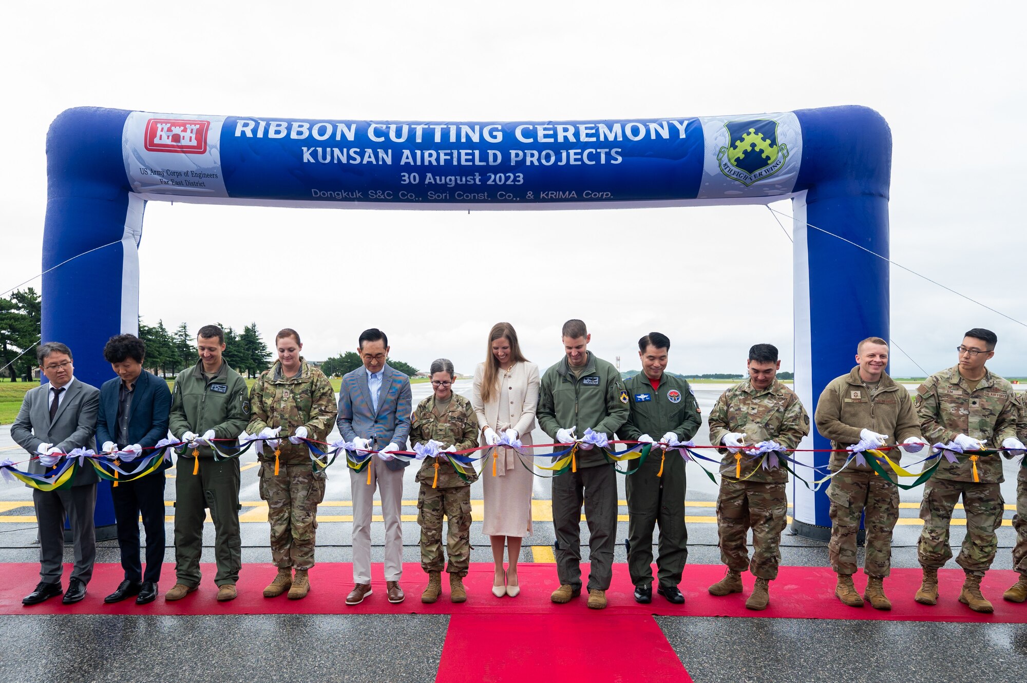 Leadership from the U.S. Air Force 8th Fighter Wing, Republic of Korea Air Force 38th Fighter Group and the Army Corp of Engineers Far East District, cut the ribbon to reopen the flightline.