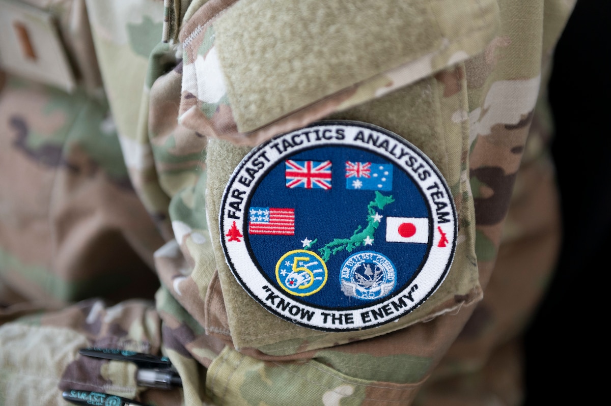 A commemorative patch from the Far East Tactics Analysis Team conference is worn by a FETAT attendee at Yokota Air Base, Japan, July 24, 2023.
