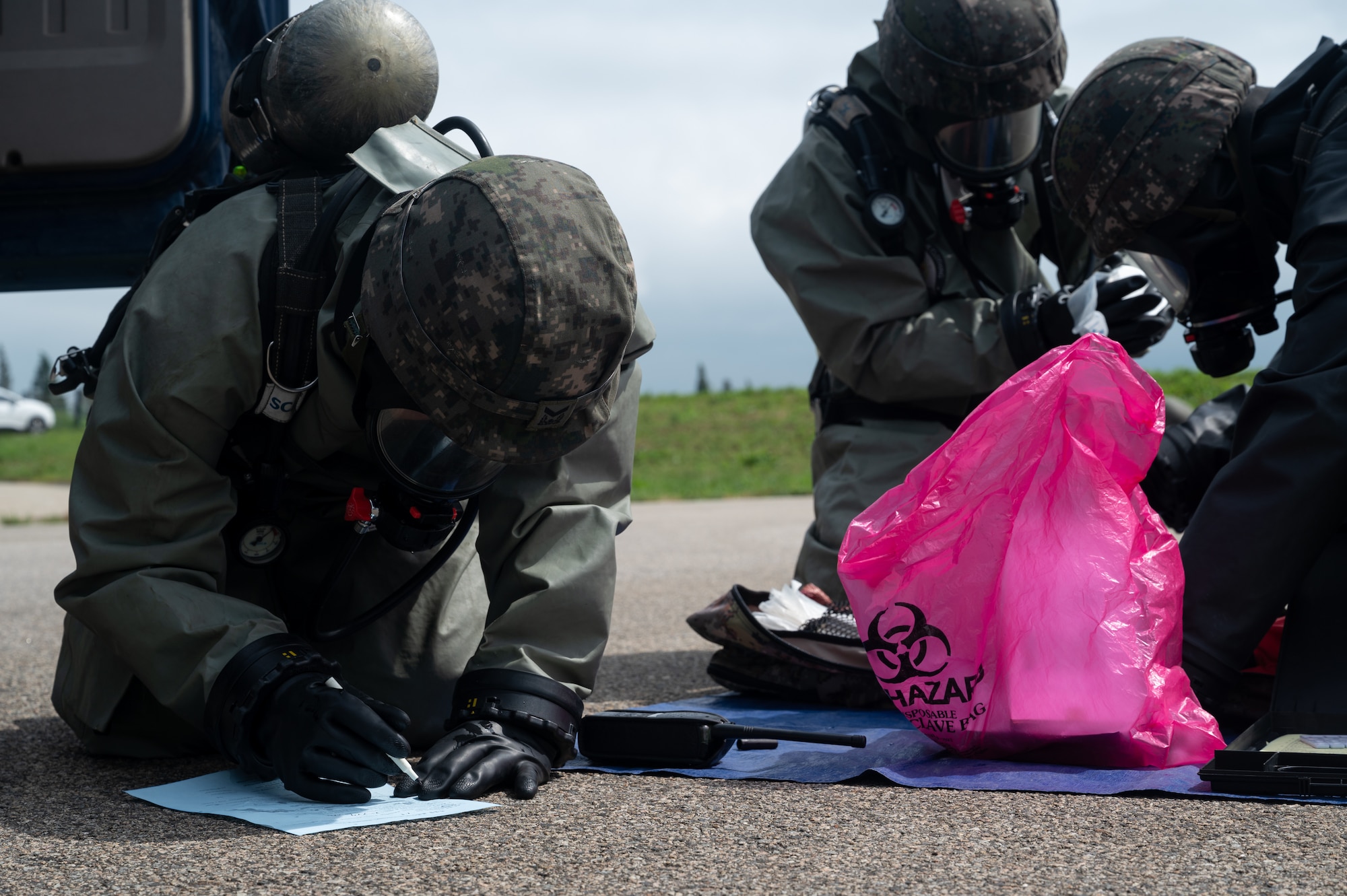 Republic of Korea Air Force airmen record simulated contamination data during combined forces chemical, biological, radiological and nuclear training with the 51st Civil Engineer Squadron at Osan Air Base, ROK, Aug. 24, 2023. CBRN response is necessary to mitigate damage to property or loss of life in case of an environmental or adversarial threat. (U.S. Air Force photo by Airman 1st Class Chase Verzaal)