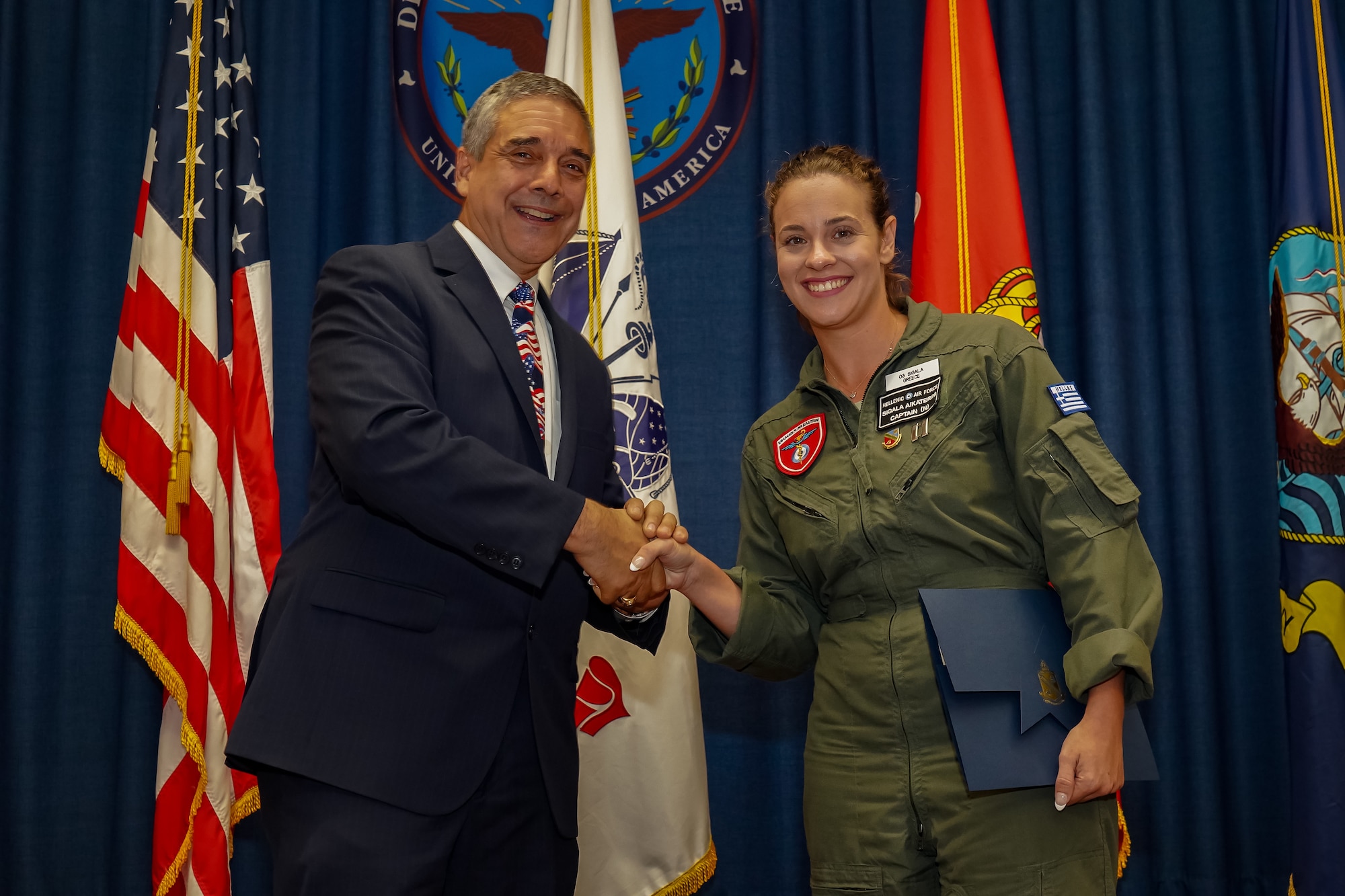 Hellenic Air Force nurse administers first-aid to maintenance worker