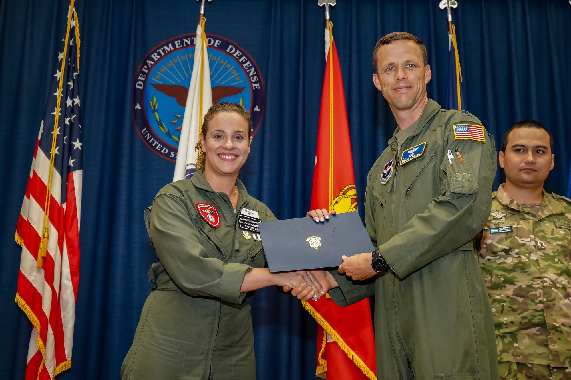 Hellenic Air Force nurse administers first-aid to maintenance worker
