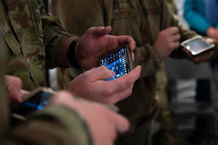 U.S. Airmen assigned to the 354th and 673rd Medical Group use the Battlefield Assisted Trauma Distributed Observation Kit, or BATDOK, tool during a capabilities-based assessment at the Yukon Training Area near Eielson Air Force Base, Alaska, Sept. 14, 2021. BATDOK, a mobile medical documentation tool developed by Air Force Research Laboratory researchers, was selected as the joint integrated electronic health record for point-of-injury and en route care by Joint Operational Medicine Information Systems, an office that provides medical information technology for military operations. (U.S. Air Force photo / Airman 1st Class Jose Miguel T. Tamondong)