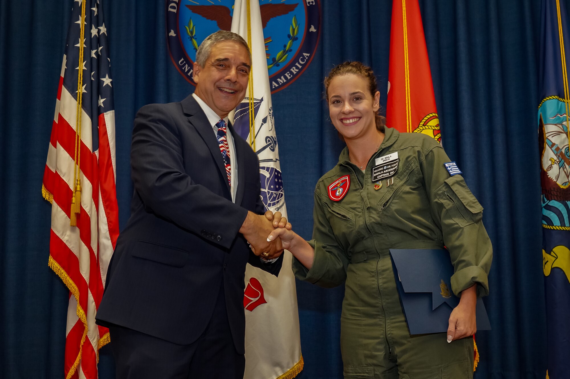 Hellenic Air Force nurse administers first-aid to maintenance worker