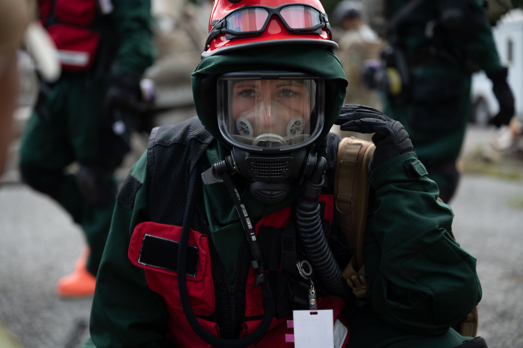 Senior Airman Cassandra Wachowiak, an aerospace medic with the 157th Medical Group, interacts with a patient during a radiological response training exercise Aug. 15, 2023, at Joint Base Cape Cod, Massachusetts. The 157th MDG was tested on its response to a radiological disaster and received a perfect score.