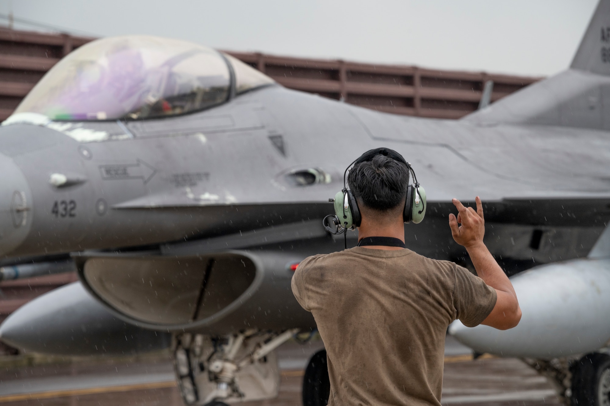 U.S. Air Force Airman 1st Class Juan Rafael Mendoza, 36th Fighter Generation Squadron crew chief, directs an F-16 Fighting Falcon before a take-off at Osan Air Base, Republic of Korea, Aug. 30, 2023.