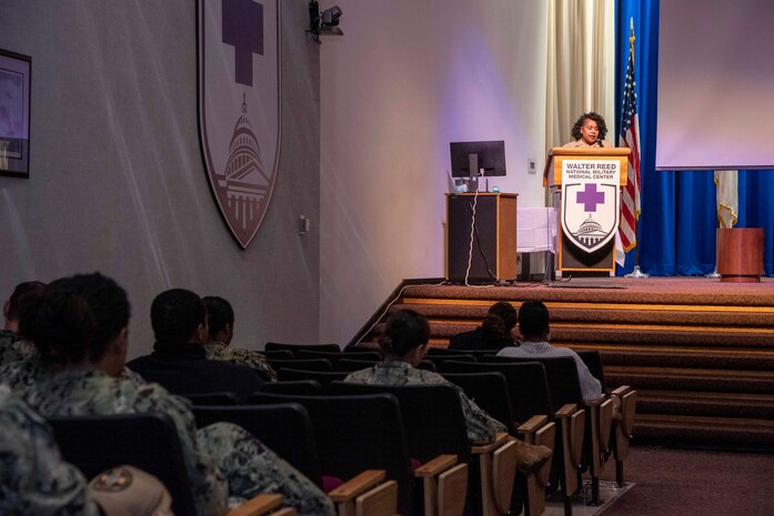 Capt. Fredora Mcrae, Navy Medicine Diversity and Inclusion Officer, speaks during a Women's Equality Day Celebration in Memorial Auditorium at Walter Reed National Military Medical Center in Bethesda, Maryland, Aug. 30, 2023. Women's Equality Day commemorates the passage of the 19th amendment to the U.S. Constitution. (U.S. Navy photo by Mass Communication Specialist 2nd Class Brett Walker)