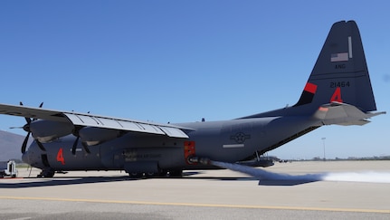 U.S. Air National Guard Airmen with the 146th Airlift Wing test the functionality of a Modular Airborne Firefighting System  unit loaded inside the cargo bay of a C-130J aircraft at Channel Islands Air National Guard Station, Port Hueneme, California, Aug. 29, 2023. The 146th Airlift Wing has been called up to help the U.S. Forest Service fight wildfires across the United States.