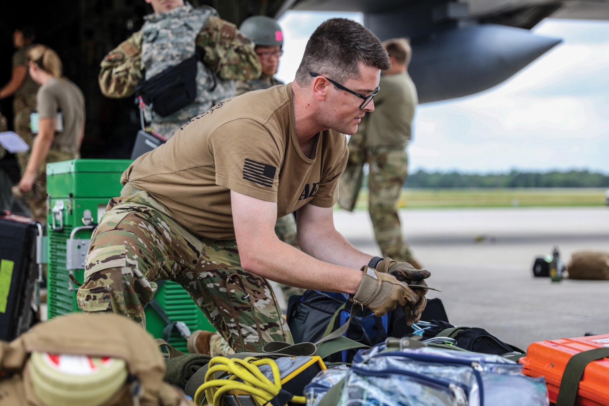 U.S. Air Force Staff Sgt. Trey Naber, 445th Aeromedical Evacuation Squadron medical technician, secures equipment after a medical care flight on a C-130H Hercules aircraft during Exercise Patriot Medic at Youngstown Air Reserve Station, Ohio, Aug. 17, 2023