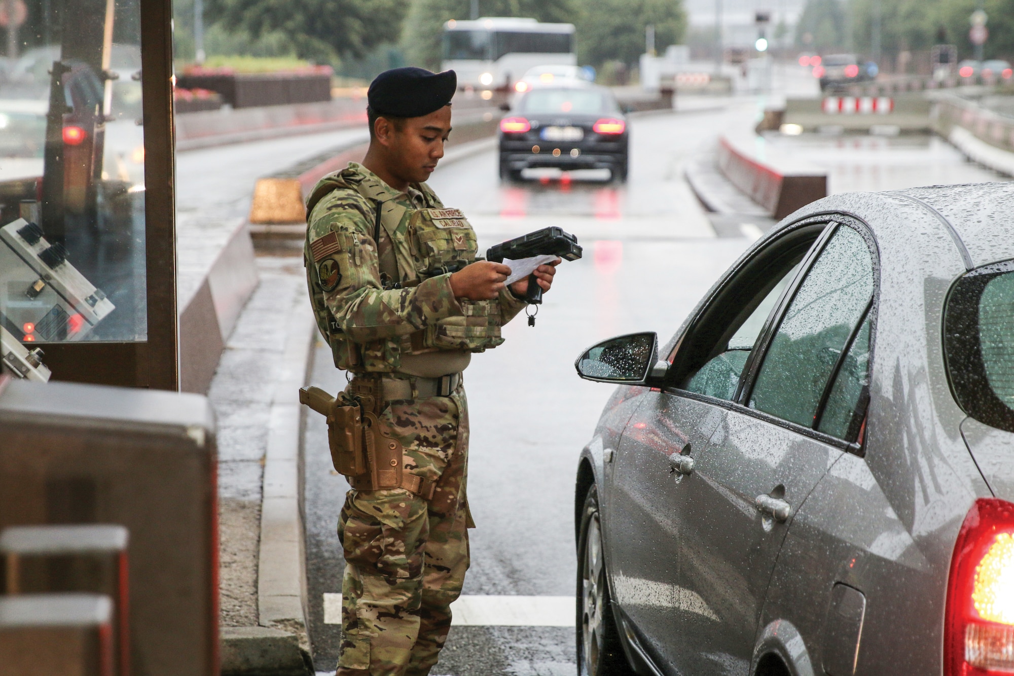 U.S. Air Force Senior Airman Gabriel Calubad, 445th Security Forces Squadron, checks credentials of individuals entering Ramstein Air Base, Germany, July 26, 2023. (U.S. Air Force photo by Capt. Rachel Ingram)