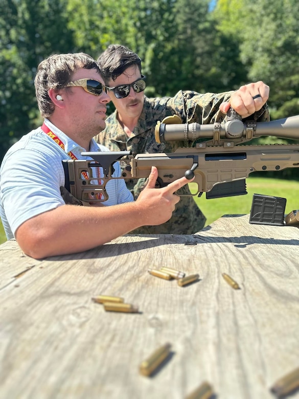 U.S. Marines with the Marine Corps Shooting Team instruct civilian leaders and business executives of the Marine Corps Executive Forum (MCEF) how to fire various issued weapons during a live-fire demonstration at Marine Corps Base Quantico, Aug. 25, 2023. During MCEF, participants are provided an inside look at the Marine Corps lifestyle and partake in activities, becoming immersed in the culture while engaging with Marines. The forum included a tour of the Pentagon with an open discussion with Marine Corps leadership on the Corps’ key issues and priorities, a live-fire demonstration at the Weapons Field Training Battalion in Quantico, an MV-22 Osprey familiarization flight, a tour of the National Museum of the Marine Corps, and attendance at an Evening Parade at Marine Barracks Washington. (U.S. Marine Corps photo by Sgt. Karis Mattingly)