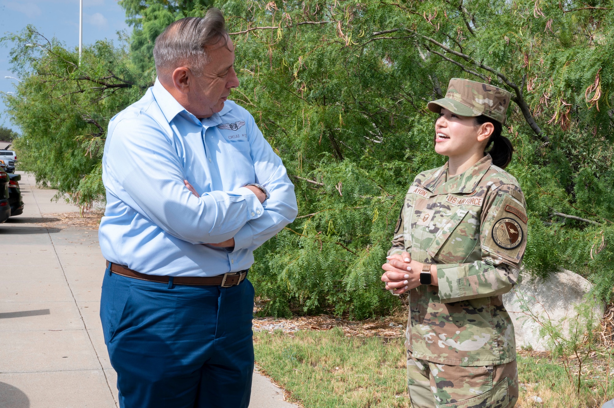 Retired Chief Master Sgt. of the Air Force Jim Finch, left, is greeted by U.S. Air Force Master Sgt. Cecilia Ayon, Airman Leadership School commandant during a tour at Holloman Air Force Base, New Mexico, Aug. 25, 2023.