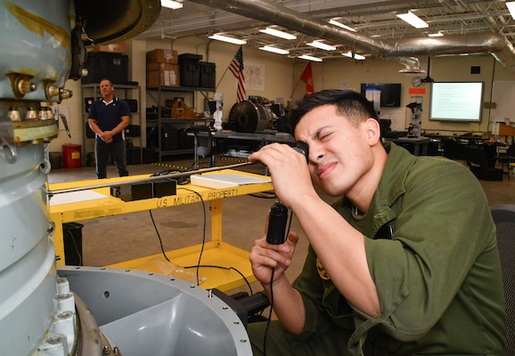 Marine Corps Lance Cpl. Jesus Hernandez, assigned to Marine Attack Squadron (VMA) 223, participates in a practical exercise March 6 as part of the F402 Engine Tier 5 Tier 5 Remote Visual Inspection (RVI) Inspector Rating certification course at Fleet Readiness Center East.