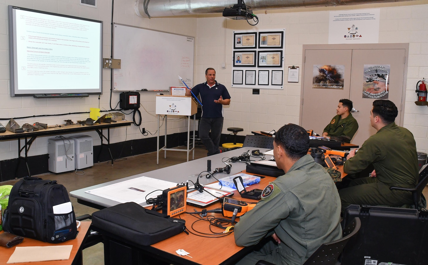 Marines assigned to Marine Attack Squadron (VMA) 223 engage in classroom discussion March 6 during the F402 Engine Tier 5 Remote Visual Inspection (RVI) Inspector Rating certification course at Fleet Readiness Center East.