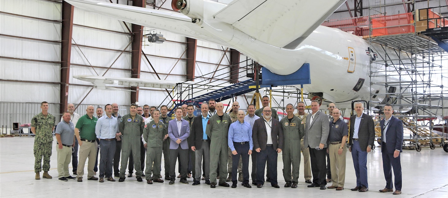 Members of the U.S. Navy and Northrop Grumman Corp. in Lake Charles, Louisiana, with the first E-6B Mercury upgraded by Northrop Grumman under the new Integrated Modification and Maintenance Contract. They include Vice Adm. Carl Chebi, commander of Naval Air Systems Command, and Capt. Adam Scott, program manager for the Airborne Strategic Command, Control and Communications Program Office.