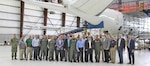 Members of the U.S. Navy and Northrop Grumman Corp. in Lake Charles, Louisiana, with the first E-6B Mercury upgraded by Northrop Grumman under the new Integrated Modification and Maintenance Contract. They include Vice Adm. Carl Chebi, commander of Naval Air Systems Command, and Capt. Adam Scott, program manager for the Airborne Strategic Command, Control and Communications Program Office.