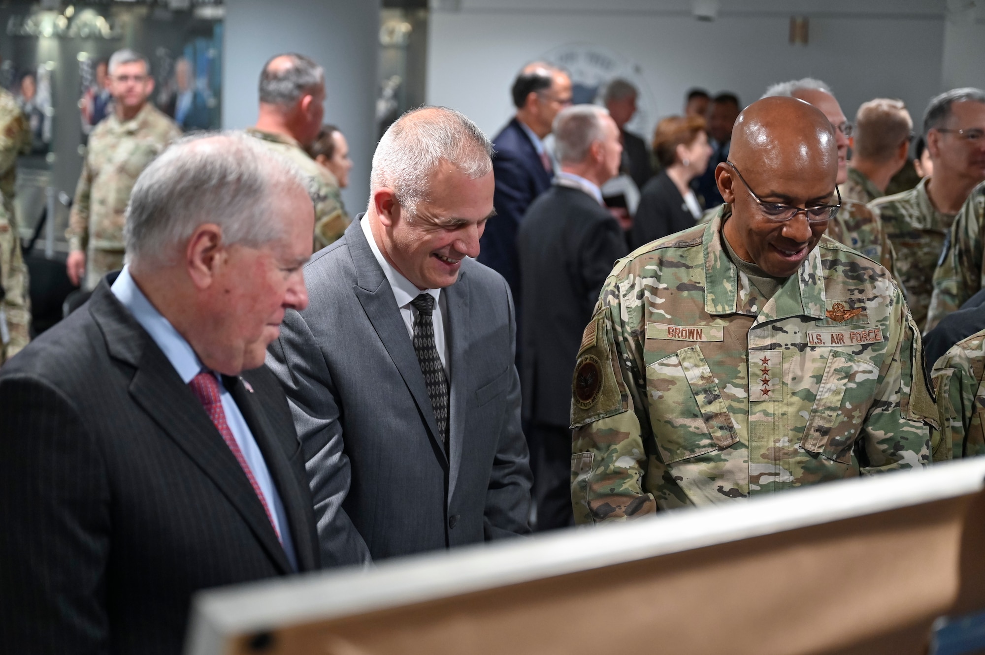 Secretary of the Air Force Frank Kendall speaks with artist Warren Neary and Air Force Chief of Staff Gen. CQ Brown, Jr. after unveiling a painting during a ceremony at the Pentagon, Arlington, Va., Aug. 29, 2023. The painting celebrates the 75th anniversary of the U.S. Air Force. (U.S. Air Force photo by Eric Dietrich)