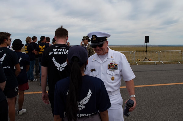 BILLINGS, Mont. (Aug. 12, 2023) Naval Medical Forces Atlantic Command Master Chief Zachary Pryor, a native of Glendive, Mont., speaks to a future U.S. Air Force Airman during the 2023 Yellowstone International Air Show at Billings-Logan International Airport.