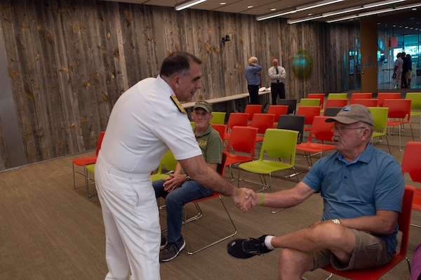 BILLINGS, Mont. (Aug. 10, 2023) Rear Adm. Matthew Case, commander, Naval Medical Forces Atlantic, meets Vietnam War veterans at the Western Heritage Center in the Billings Public Library.