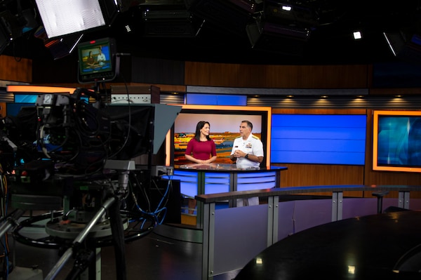 BILLINGS, Mont. (Aug. 11, 2023) Rear Adm. Matthew Case, commander, Naval Medical Forces Atlantic, speaks with Augusta McDonnell, the news anchor for Montana This Morning, during a live interview at KTVQ studio.