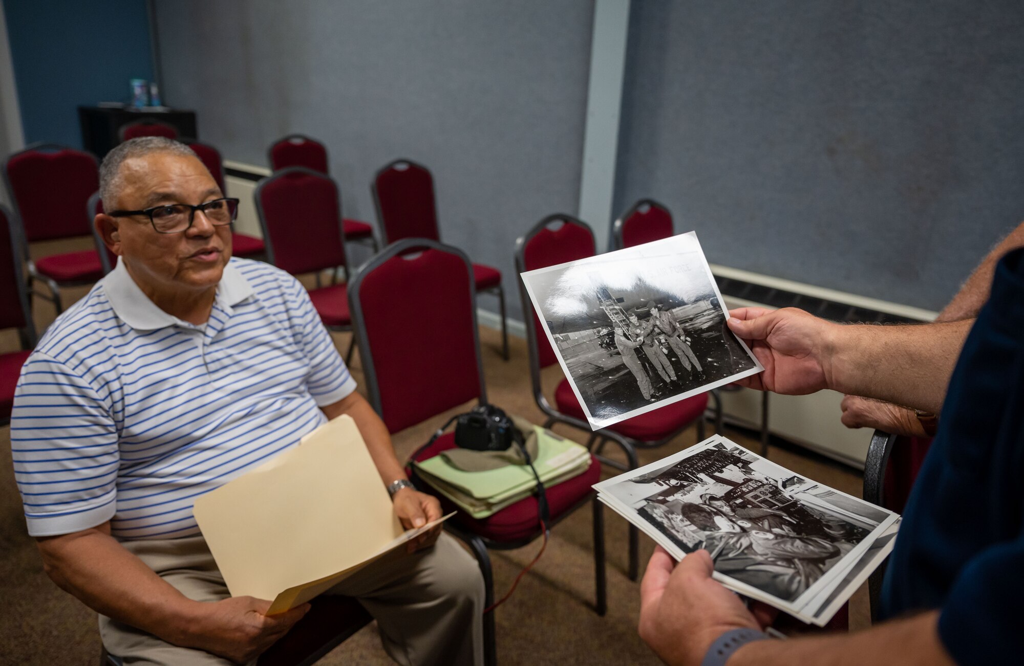 U.S. Air Force retired Lt. Col. William Jordan tells Air Mobility Command Museum volunteers stories about his time on active duty at the AMC Museum on Dover Air Force Base, Delaware, Aug. 25, 2023. Jordan was the commander of the first all African American C-5A Galaxy mission in 1986 and provided the museum with historical documentation from his time spent on active duty. (U.S. Air Force photo by Airman 1st Class Amanda Jett)