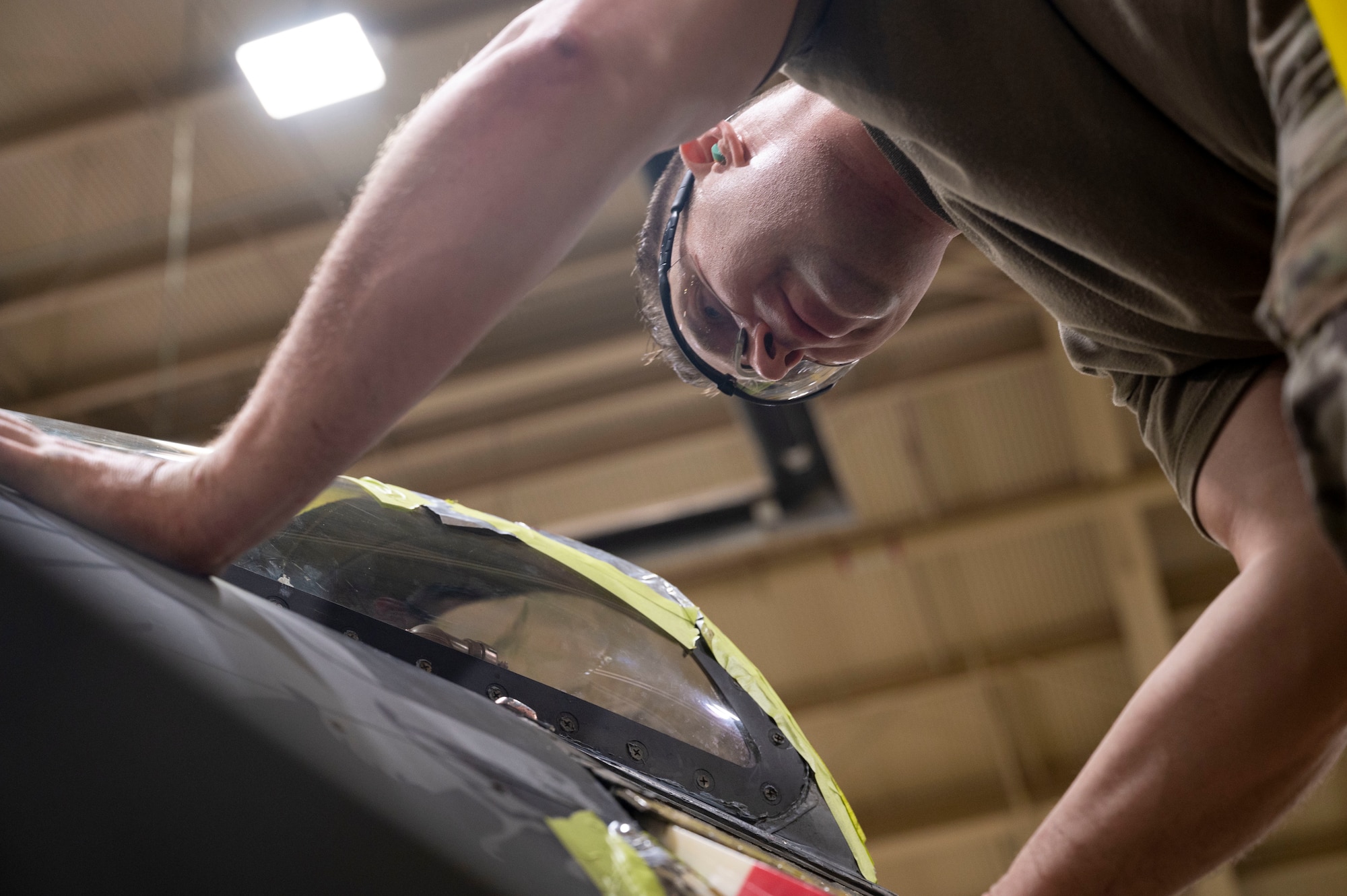 U.S. Air Force Tech. Sgt. Robert McPherson, 49th Equipment Maintenance Squadron aircraft structural maintenance noncommissioned officer in charge, performs depot-level repairs on an F-16 Viper at Holloman Air Force Base, New Mexico, Aug. 1, 2023.