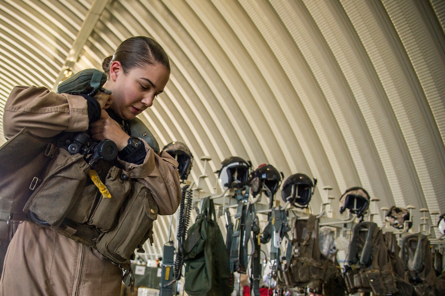 U.S. Marine Cpl. Shannon Kunz, crew chief on a UH-1Y Huey assigned to Marine Light Attack Helicopter Squadron 369, Marine Light Attack Helicopter Squadron 369, 3rd Marine Aircraft Wing, puts on her life support vest during Integrated Training Exercise 2-16 at Marine Corps Air Ground Combat Center, Twentynine Palms, Calif., Jan. 24, 2016. MCAGCC conducts relevant live-fire combined arms, urban operations, and joint/coalition level integration training that promote operational forces' readiness.