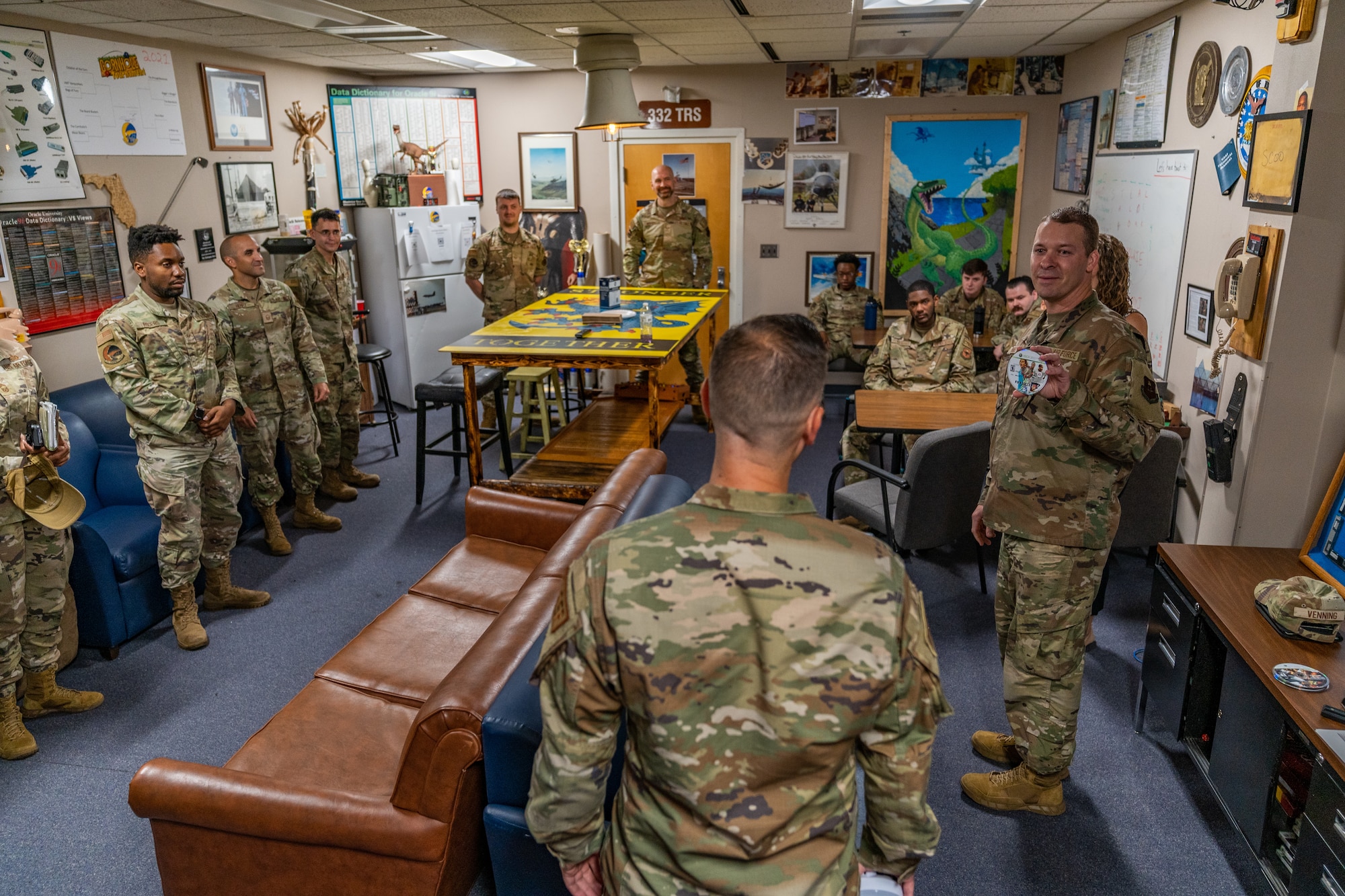 U.S. Air Force Chief Master Sgt. Michael Venning, 81st Training Wing command chief, speaks with the 81st Communications Squadron in their break room during his immersion tour at Keesler Air Force Base, Mississippi, Aug. 2, 2023.