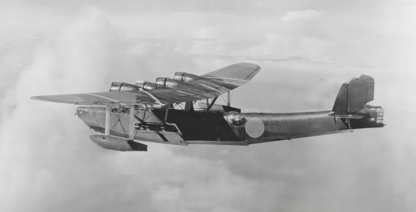 This H6K Type 97 Mavis carries small 132-pound bombs under its parasol wings in addition to several 7.9 mm machine guns in waits positions in the fuselage as well as a 20mm cannon in a tail turret. This large flying boat occasionally flew bombing missions.