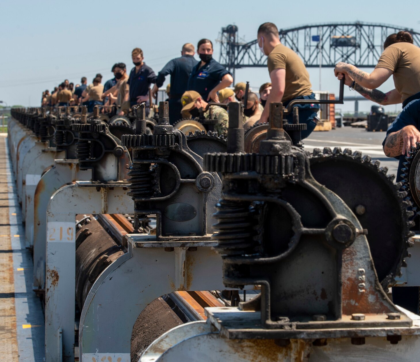 Sailors conduct catapult maintenance on the flight deck aboard the aircraft carrier USS George H. W. Bush (CVN 77). GHWB is at Norfolk Naval Shipyard undergoing its Docking Planned Incremental Availability.