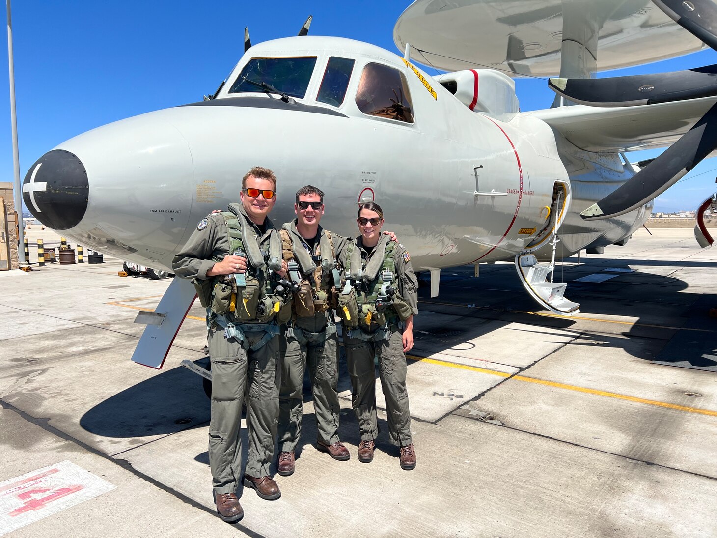 At far right, Lt. Erica Sciscoe, a Naval Flight Officer and safety program manager with Fleet Readiness Center Southwest, poses wtih Cmdr. David Geleszynski, left, and Cmdr. Matt Ostrem.