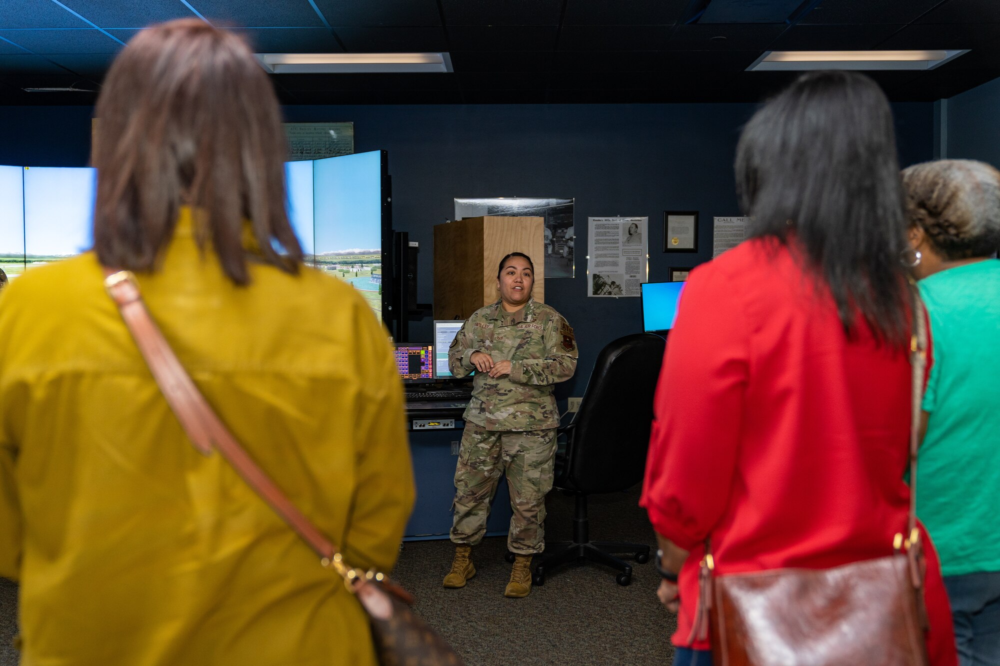 U.S. Air Force Staff Sgt. Susana Twilley, 334th Training Squadron instructor, briefs educators on how they teach air traffic control students at Keesler Air Force Base, Mississippi, Aug. 16, 2023.
