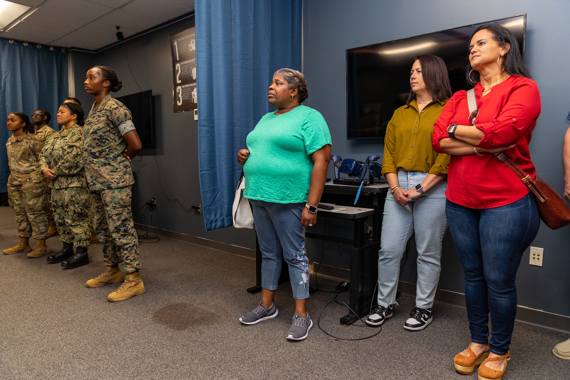 Delisa Brooks, Homewood High School career coach specialist, Adrienne Millet, West Jefferson High School assistant principal and Sonia Rivera, Enterprise High School science teacher, observe a class on weather at Keesler Air Force Base, Mississippi, Aug. 16, 2023.