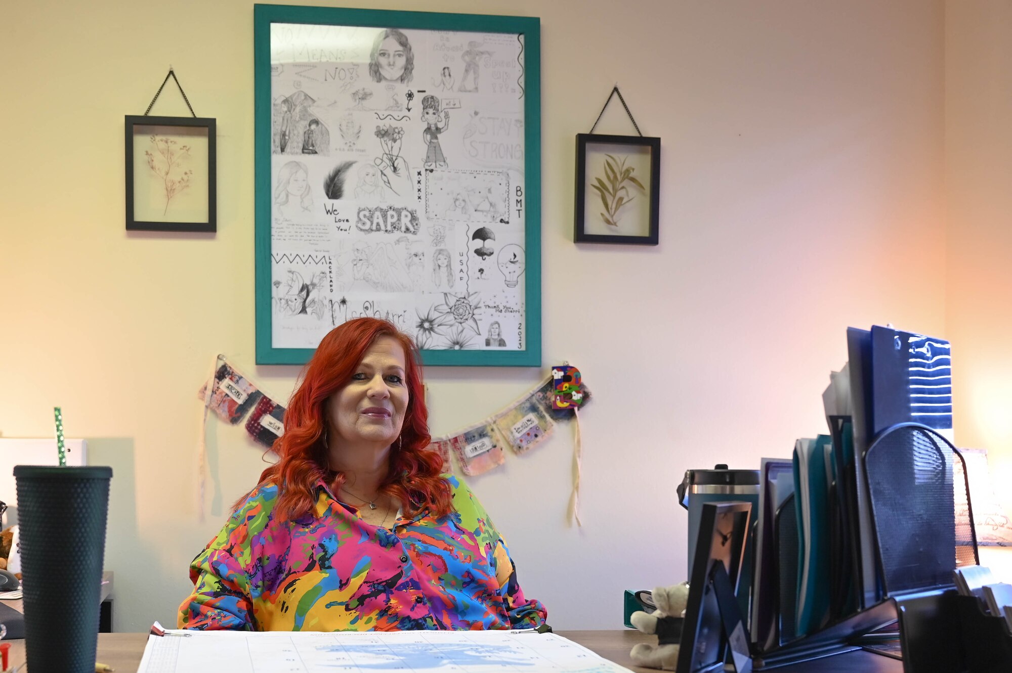 Sherri Barton, 97th Air Mobility Wing Sexual Assault Prevention and Response (SAPR) victim advocate, sits at her desk for a photo at Altus AFB, Oklahoma, August 16, 2023. The SAPR Program was created to reinforce the Air Force’s commitment to preventing and eliminating sexual harassment and assault through training, education, reporting, victim advocacy and accountability. (U.S. Air Force photo by Airman 1st Class Heidi Bucins)