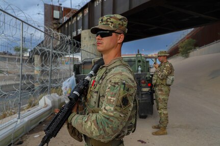 Oklahoma Army National Guard Soldiers, Spc. Blake Morgan (left), member of the 45th Infantry Brigade Combat Team, and Sgt. Chance Minter (right), member of the 45th Field Artillery Brigade, perform border operations along the Rio Grande in El Paso, Texas, August 16, 2023. Approximately 50 Soldiers and Airmen are assisting the Texas National Guard with border security by manning security points to identify and alert local law enforcement of any illegal immigrant or drug trafficking activities. The deployment is expected to last through the end of August with a follow-on deployment of an additional 50 Soldiers and Airmen sometime in 2024. (Oklahoma National Guard photo by Sgt. Reece Heck)